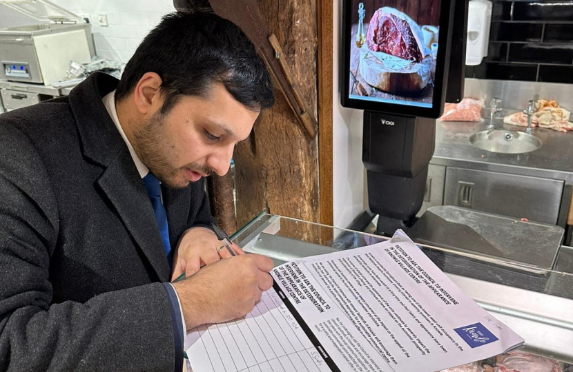 Saqib Bhatti MP signing the petition in Knowle 